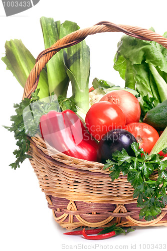 Image of basket with vegetables isolated on white 