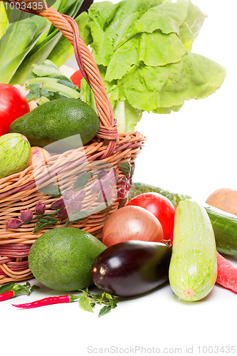 Image of basket with vegetables isolated on white 