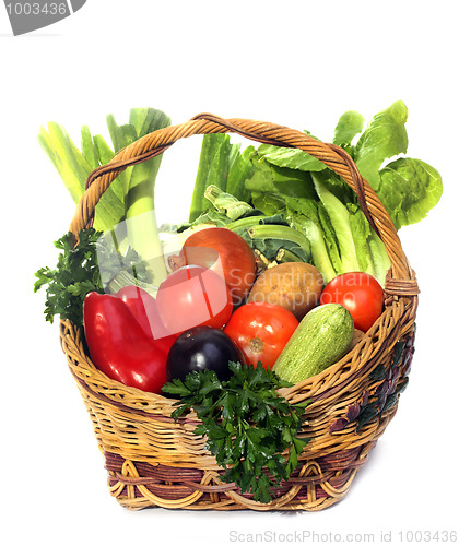 Image of basket with vegetables isolated on white 