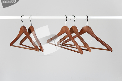 Image of Wooden hangers on a rod