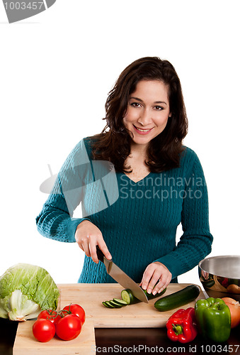 Image of Woman cooking in kitchen