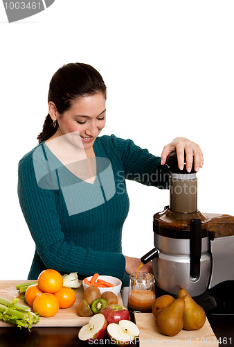 Image of Woman making fruit juice