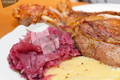 Image of roasted duck with red cabbage and dumplings