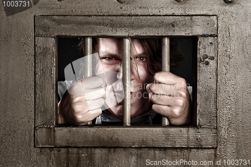 Image of CP of a man behind bars