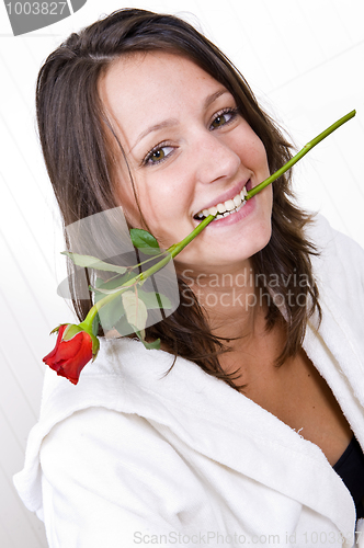 Image of Woman biting rose