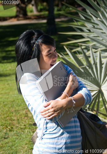 Image of Student holding notes