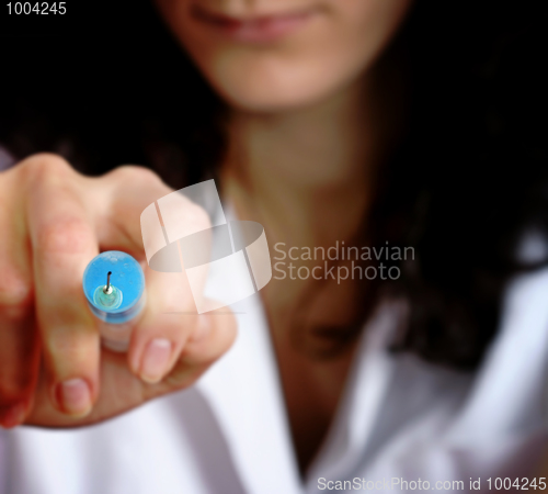 Image of Portrait of a young doctor with syringa.