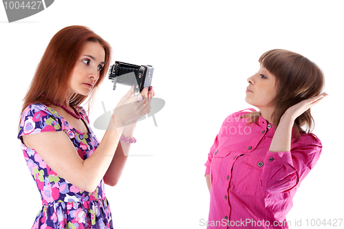 Image of Two beautiful girls to pose