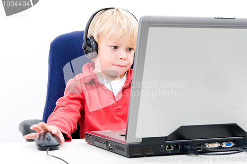 Image of Boy behind a laptop