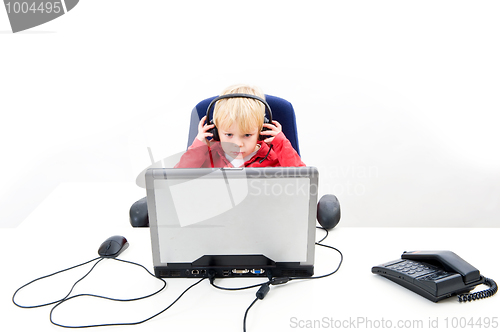 Image of Boy behind a laptop