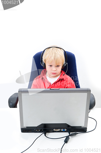 Image of Boy behind a laptop