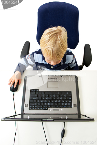 Image of Young Boy Using Laptop