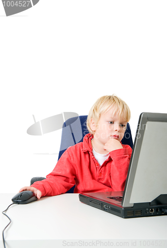 Image of Boy behind laptop