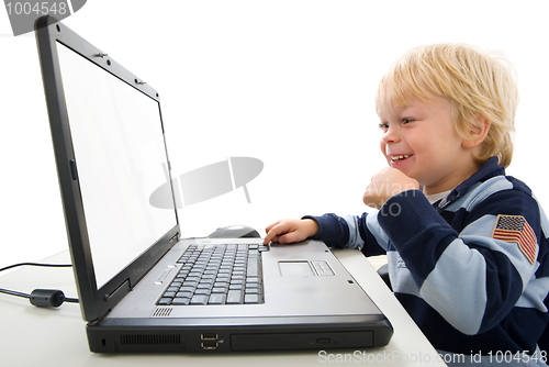 Image of Young Boy Using Laptop