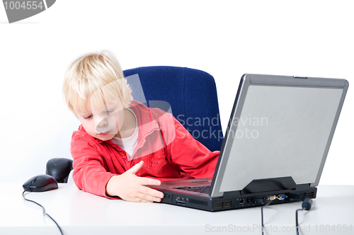 Image of Boy working on a laptop