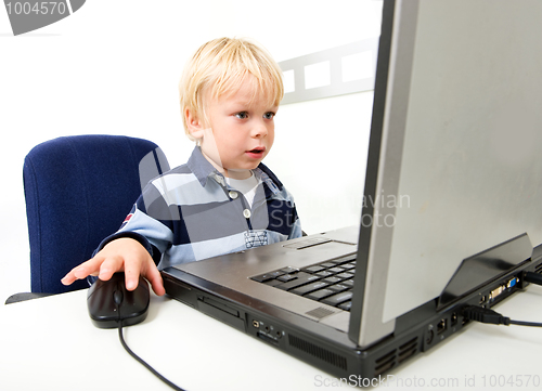 Image of Young Boy Using Laptop