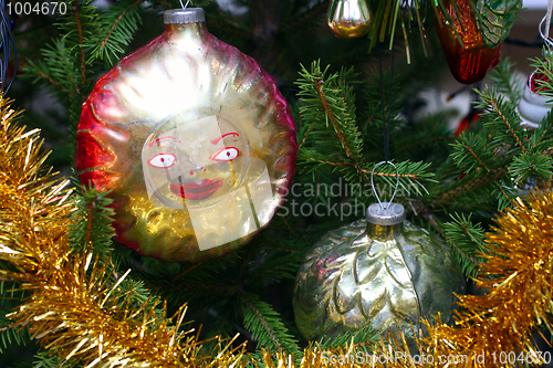 Image of old christmas decorations on fir