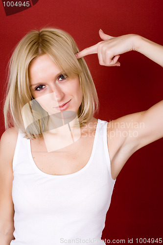 Image of blonde gesturing a shoot in her head