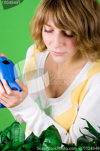 Image of girl watering flowers