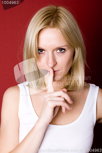 Image of woman with finger on lips