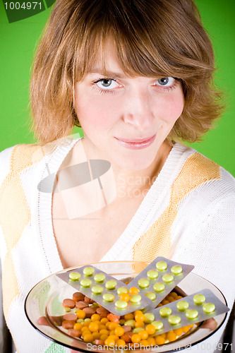 Image of woman with heap of pills