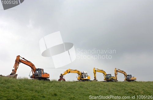 Image of Four diggers on a dyke