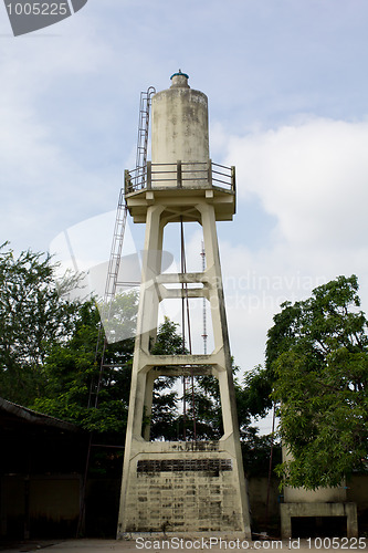 Image of Old abandoned industrial water tower with reservoir tank in  fac