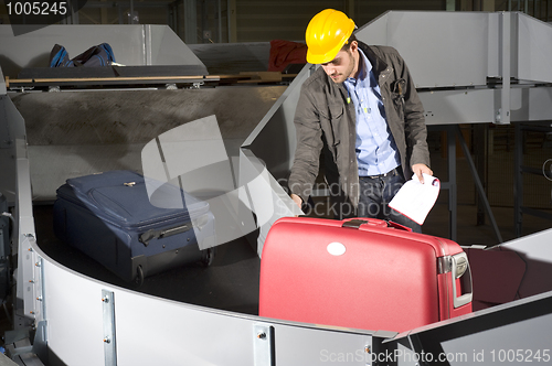 Image of Luggage belt worker