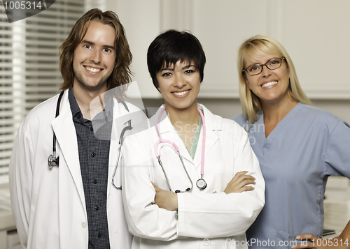 Image of Three Smiling Male and Female Doctors or Nurses