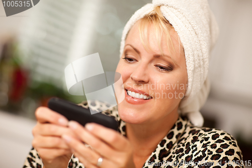 Image of Attractive Woman Texting With Her Cell Phone