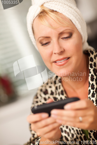 Image of Attractive Woman Texting With Her Cell Phone