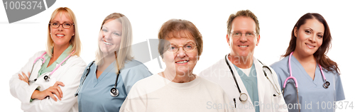 Image of Smiling Senior Woman with Medical Doctors and Nurses Behind