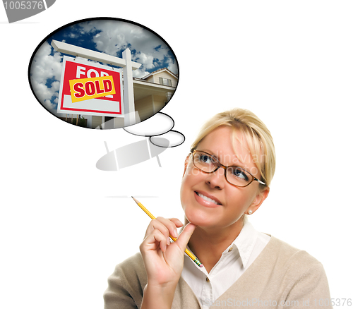 Image of Woman with Thought Bubbles of a Sold Real Estate Sign