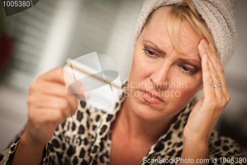 Image of Upset Woman Holding Her Credit Card