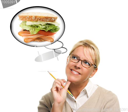 Image of Hungry Woman with Thought Bubbles of Big, Fresh Sandwich