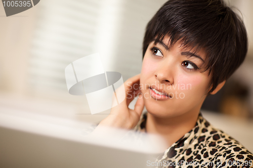 Image of Pretty Smiling Multiethnic Woman Using Laptop