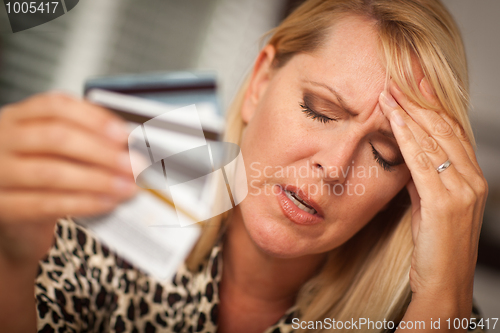 Image of Upset Woman Holding Her Many Credit Cards