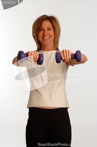 Image of beautiful woman in fitness gym