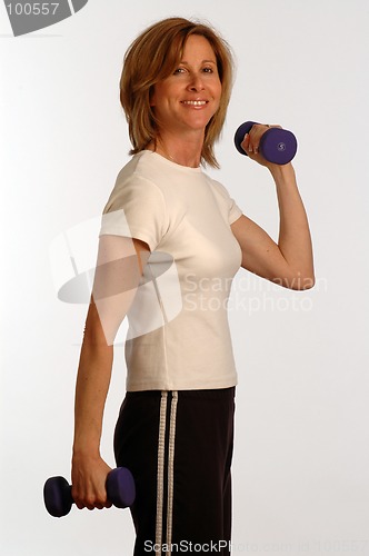 Image of beautiful woman in fitness gym