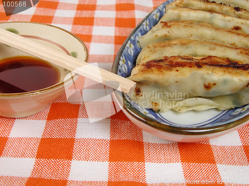 Image of Gyoza and soy sauce