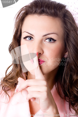 Image of young woman with finger on lips