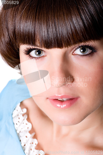 Image of attractive brunet woman in blue dress