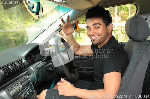 Image of Happy male driver holding car keys