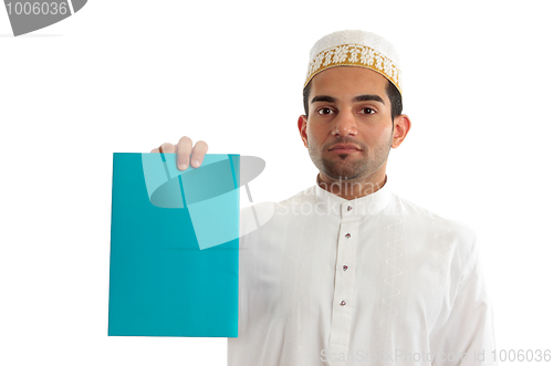 Image of Ethnic businessman with brochure or advertisement