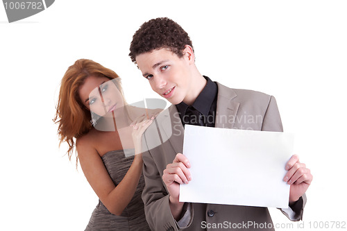 Image of young couple, man holding  a paperboard in hand,she looking for him,