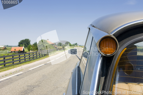 Image of A classic french car in a typical Dutch landscape