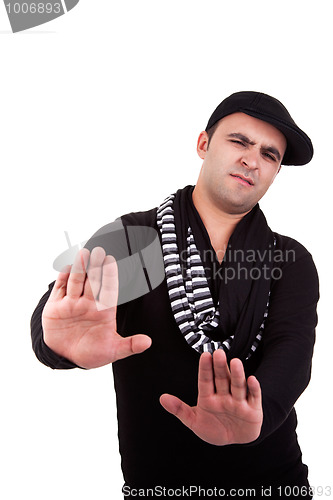 Image of Young man with hands as a sign of removal / negation