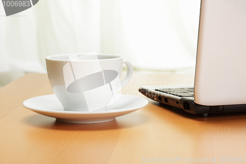 Image of Cup and laptop