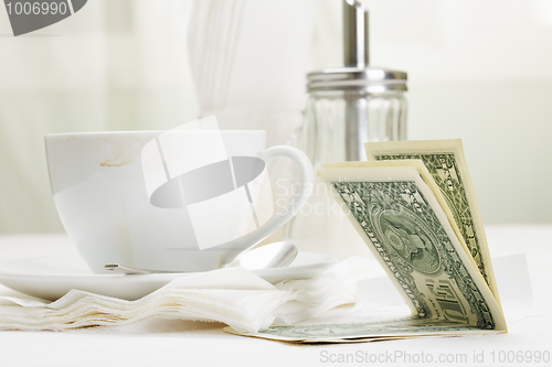 Image of Dollars in payment for coffee