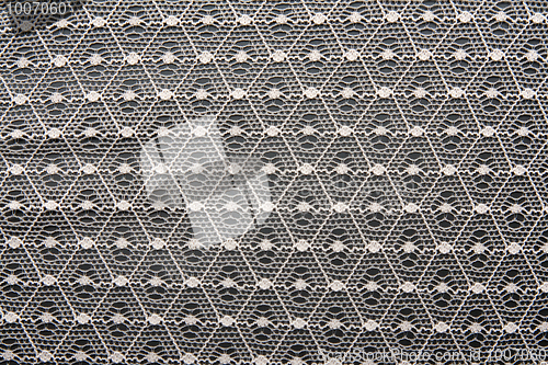 Image of White lace on black background